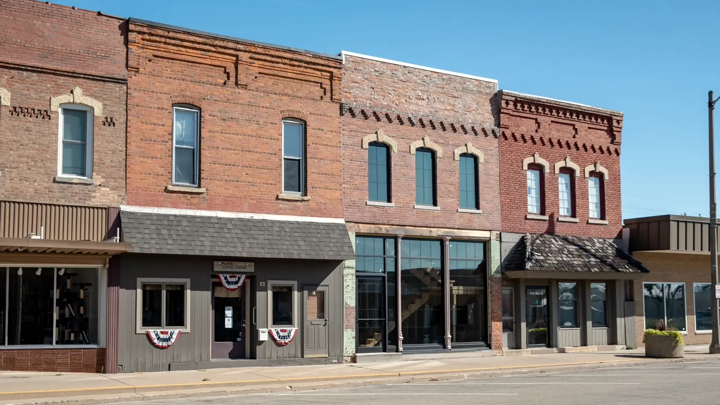 Row of brick storefronts on a small-town main street