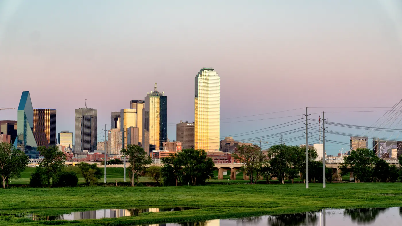 Dallas skyline at dusk reflected in Trinity River wetlands