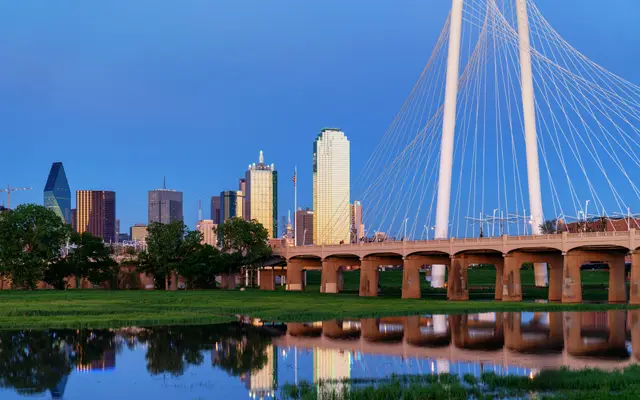 Margaret Hunt Hill Bridge and Dallas skyline reflected in water