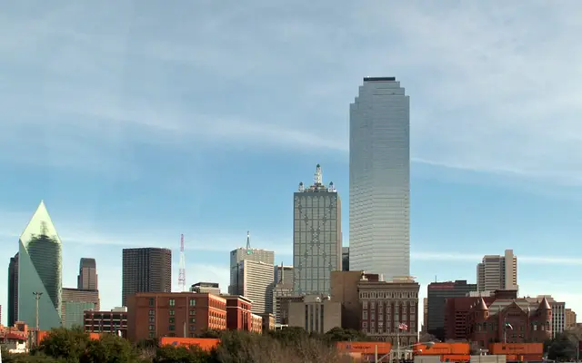 Bank of America Plaza rising over downtown Dallas buildings