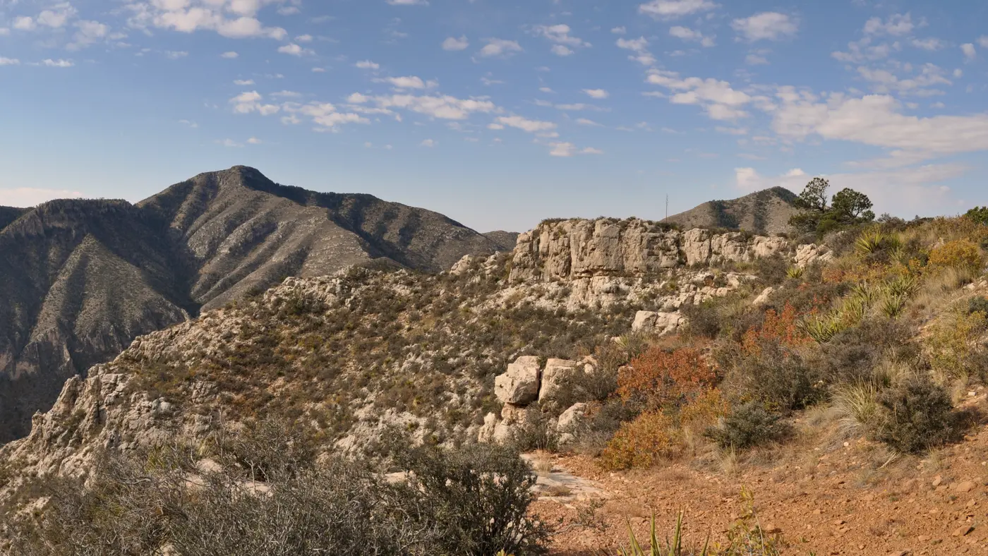 Rugged West Texas mountain ridge under a wide blue sky