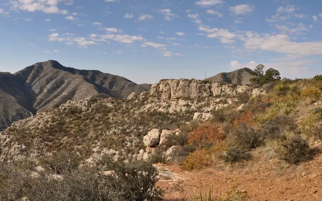 Rugged West Texas mountain ridge under a wide blue sky