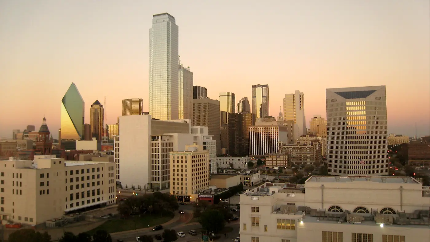 Downtown Dallas skyline glowing in warm sunset light