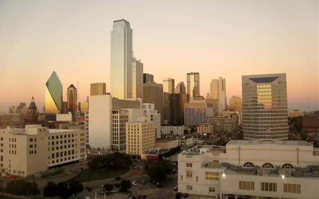 Downtown Dallas skyline glowing in warm sunset light