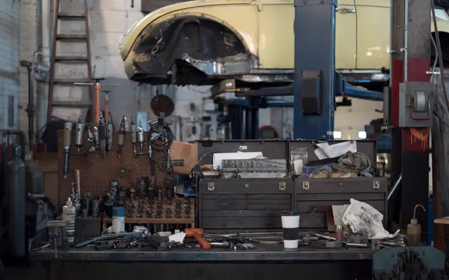 Workshop wall of tools and a tool chest in a repair garage