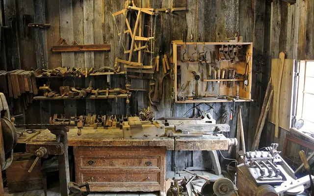 Traditional woodworking shop with hand tools hanging on the walls