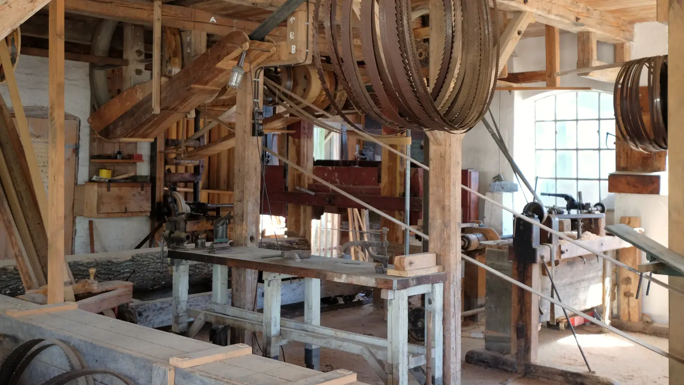 Old timber sawmill workshop with bandsaw blades and workbenches