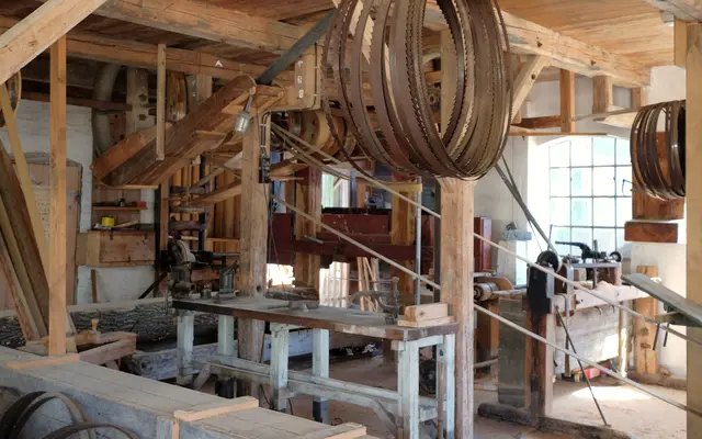 Old timber sawmill workshop with bandsaw blades and workbenches