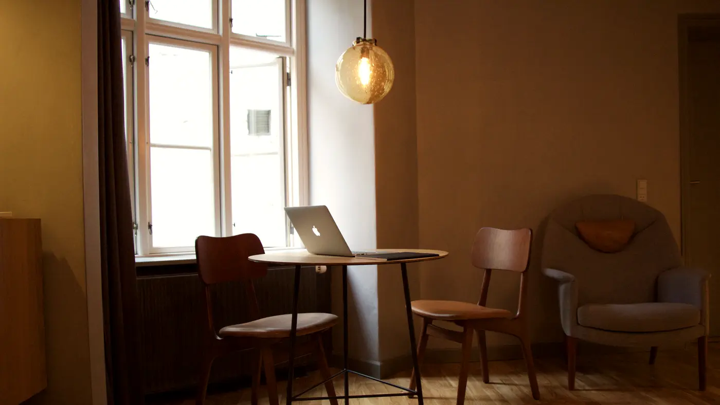 Quiet room with a laptop on a table by the window