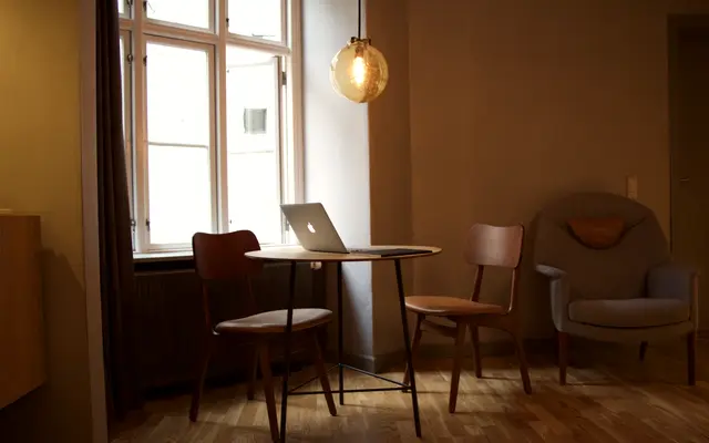 Quiet room with a laptop on a table by the window