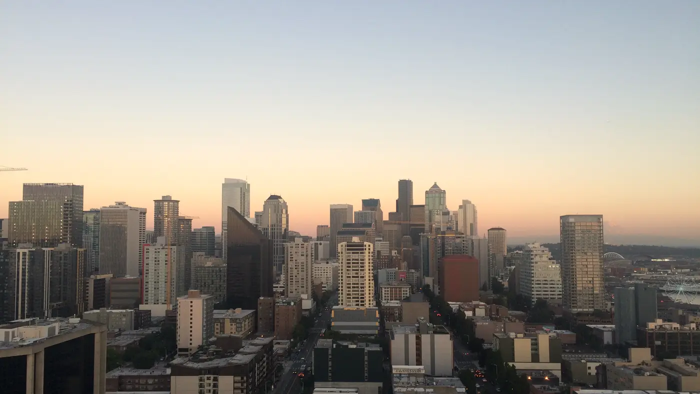 Downtown skyline at sunset seen from a high rooftop