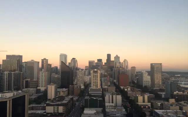 Downtown skyline at sunset seen from a high rooftop