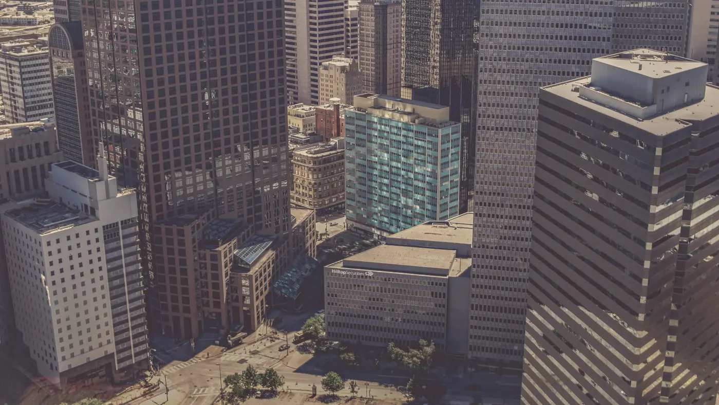 Aerial view of downtown office towers above a city plaza