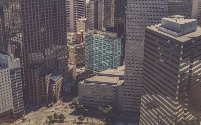 Aerial view of downtown office towers above a city plaza