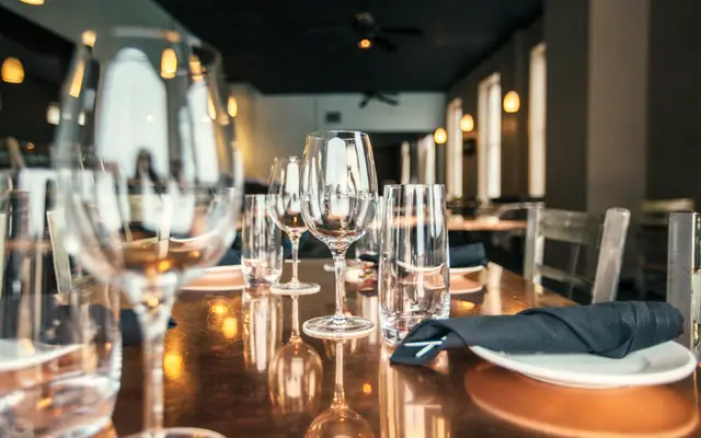 Set restaurant table with wine glasses in a quiet dining room