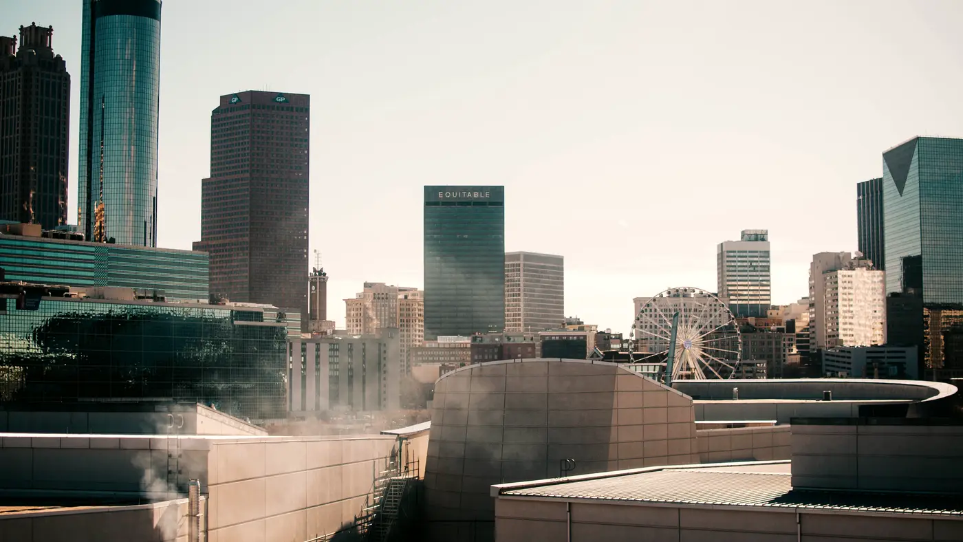 Downtown office towers rising above low modern rooftops