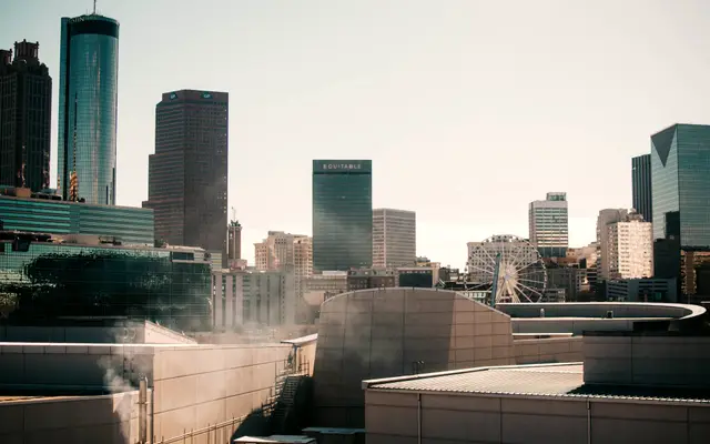 Downtown office towers rising above low modern rooftops