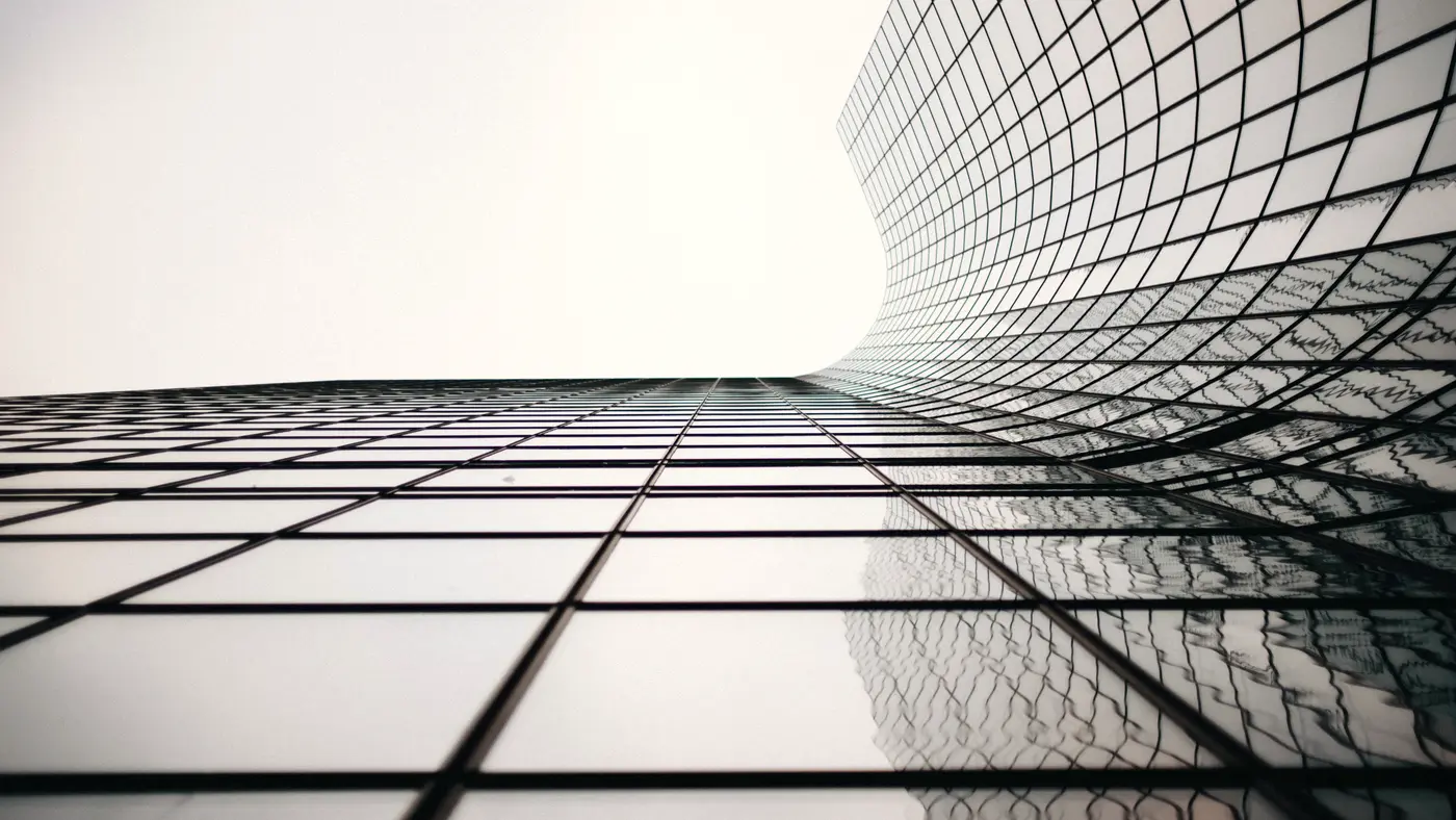 Curved glass grid facade of a modern tower