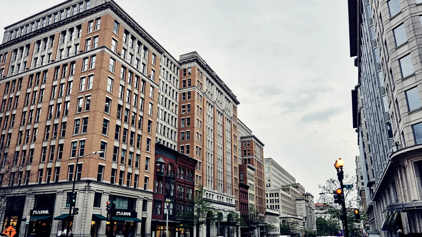 Downtown street corner lined with brick office buildings