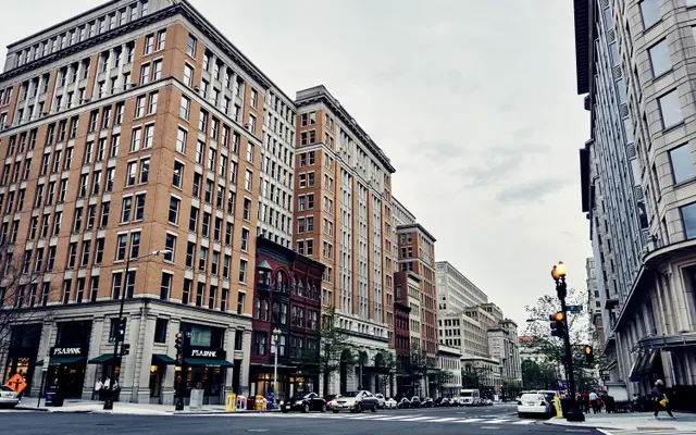 Downtown street corner lined with brick office buildings