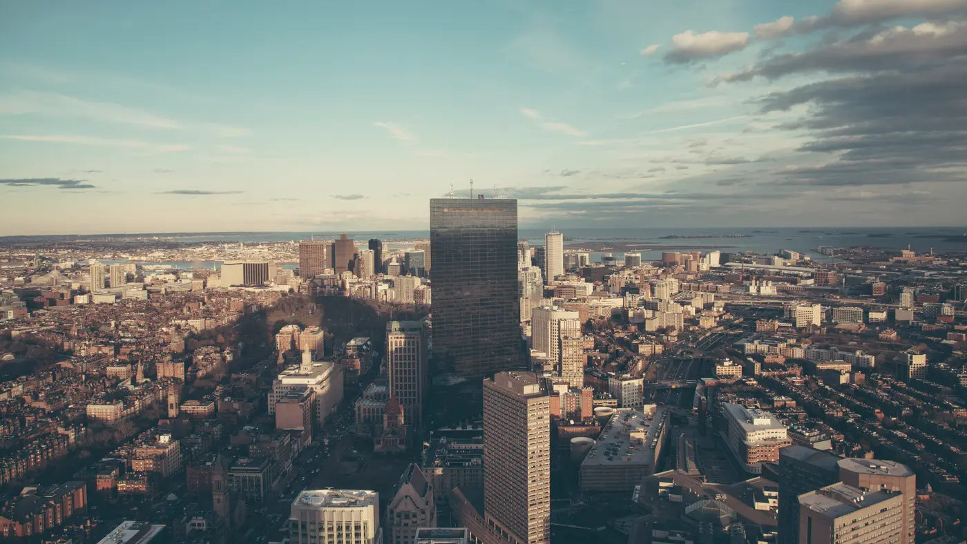 Aerial view over a downtown district under a wide sky