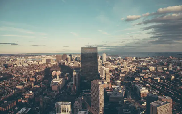 Aerial view over a downtown district under a wide sky