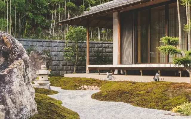 Landscaped garden with raked gravel, stones and a timber pavilion