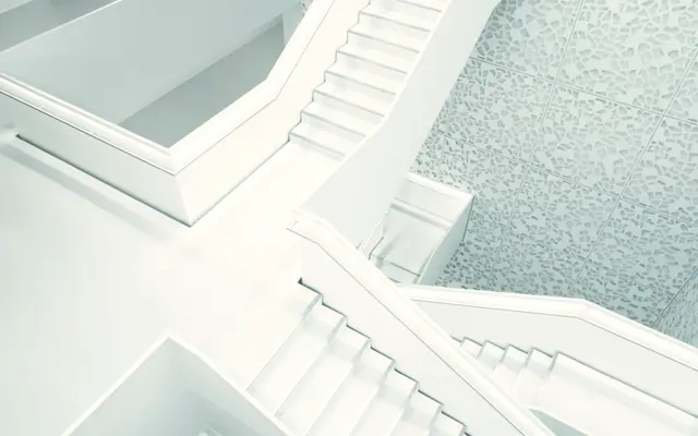 White minimalist staircase and walls seen from above