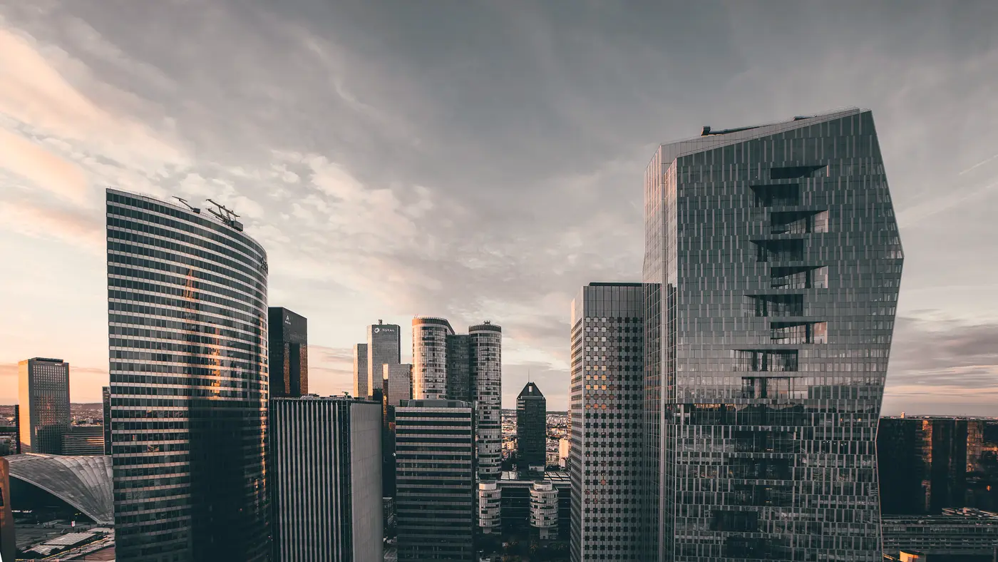 Modern downtown skyline under a cloudy evening sky