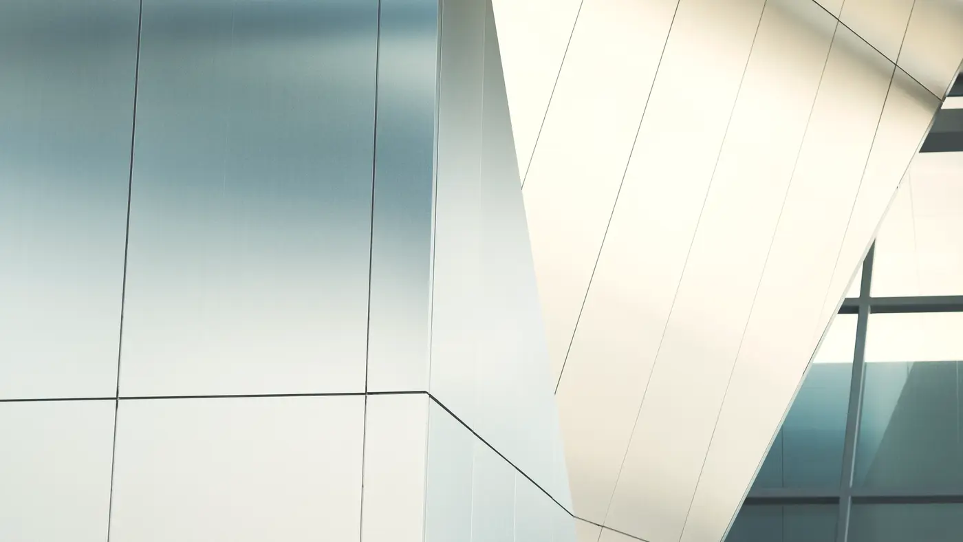 White and glass panels of a modern building facade