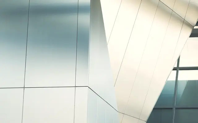White and glass panels of a modern building facade