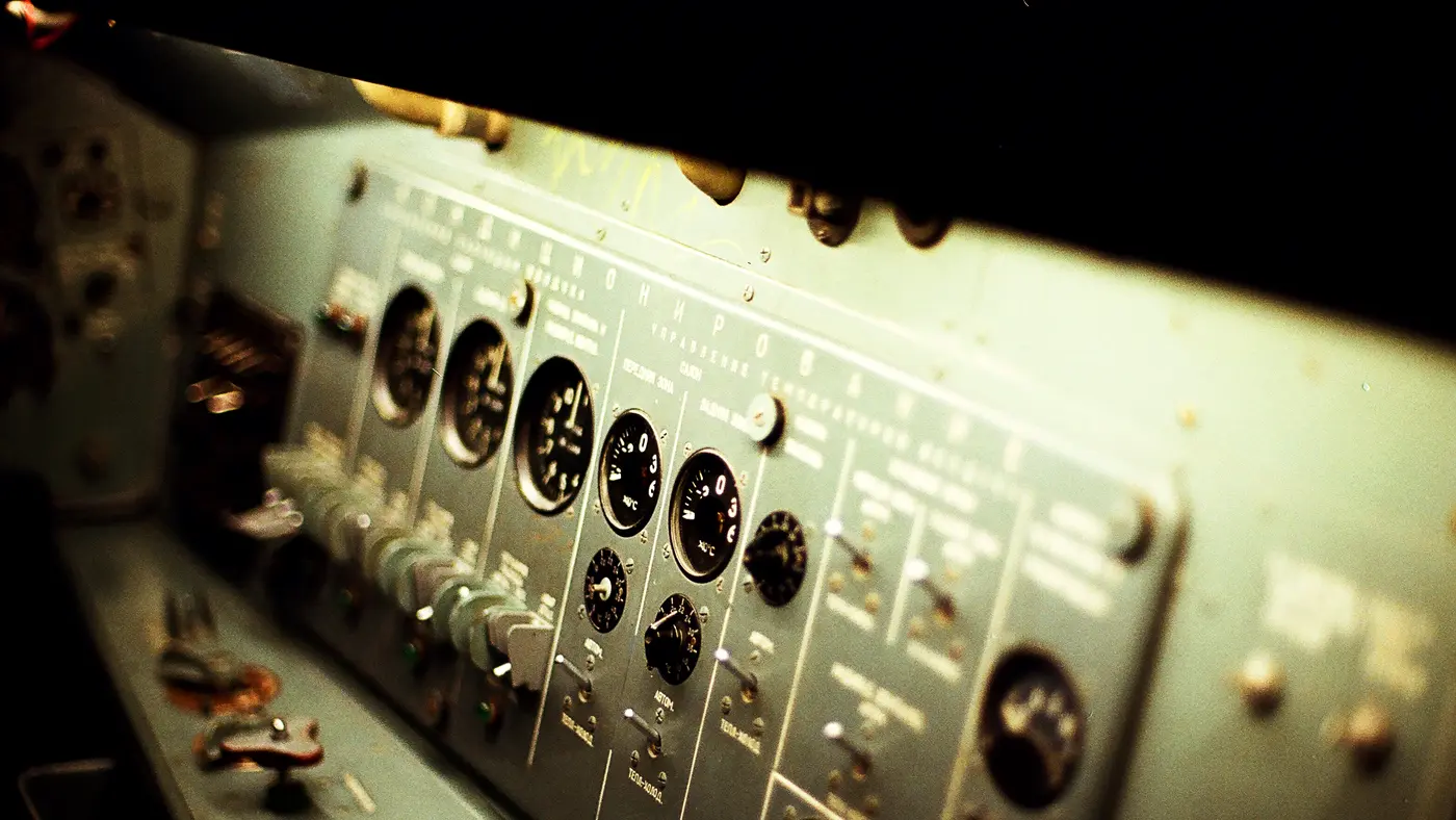 Vintage industrial control panel with dials and switches