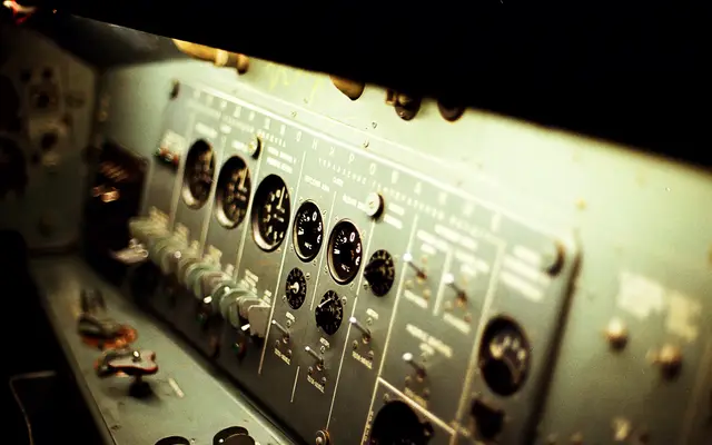Vintage industrial control panel with dials and switches