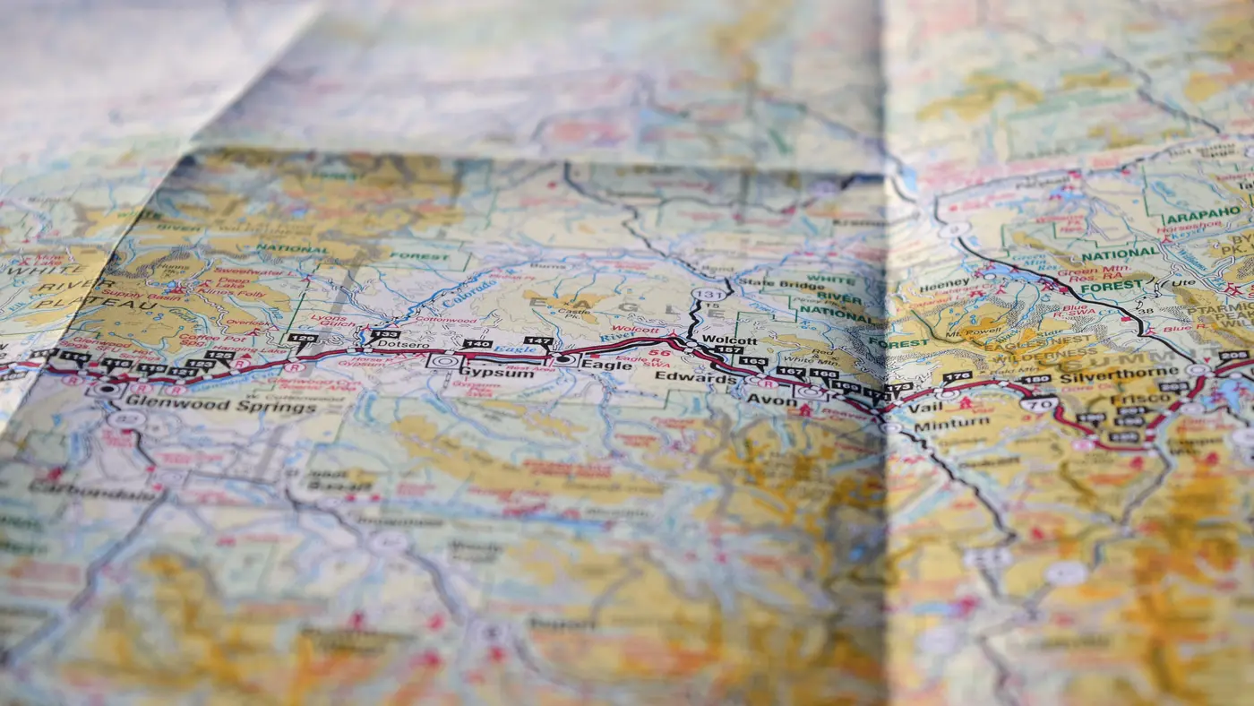 Close-up of a folded road map with a highway route