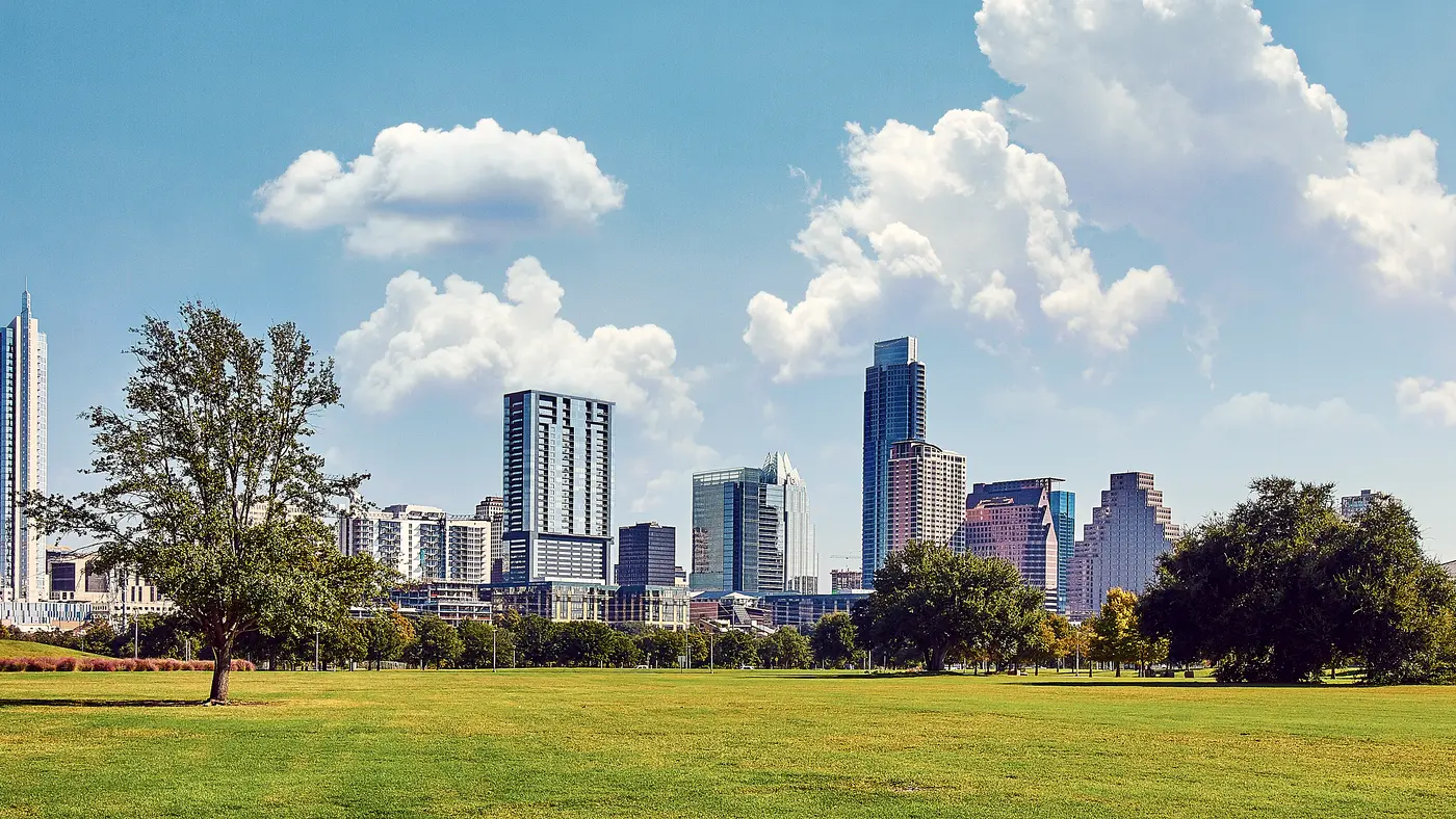 Austin downtown skyline seen across a wide green park lawn