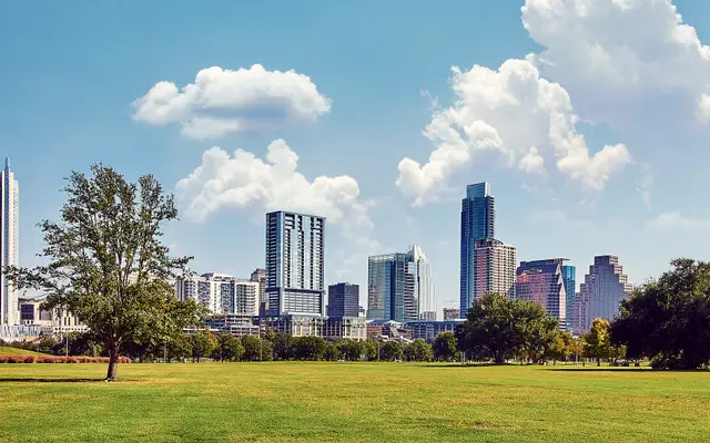 Austin downtown skyline seen across a wide green park lawn