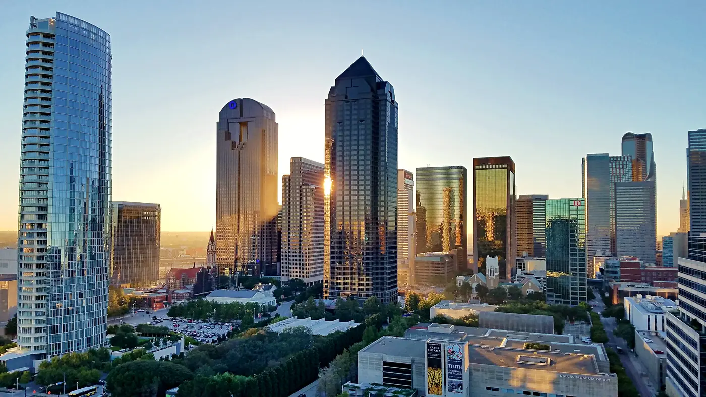 Downtown Dallas glass towers catching golden evening light
