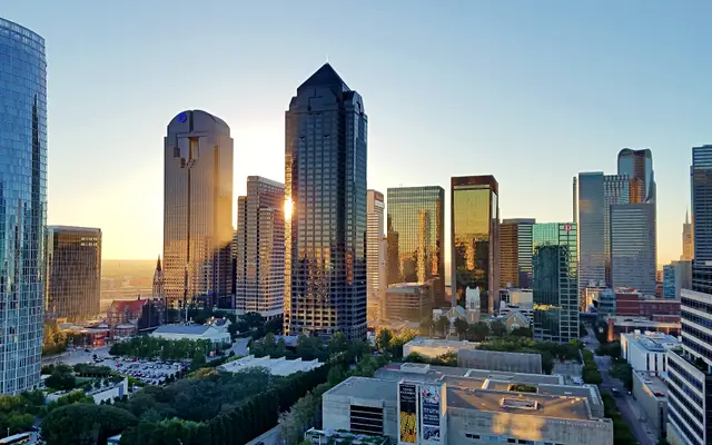 Downtown Dallas glass towers catching golden evening light