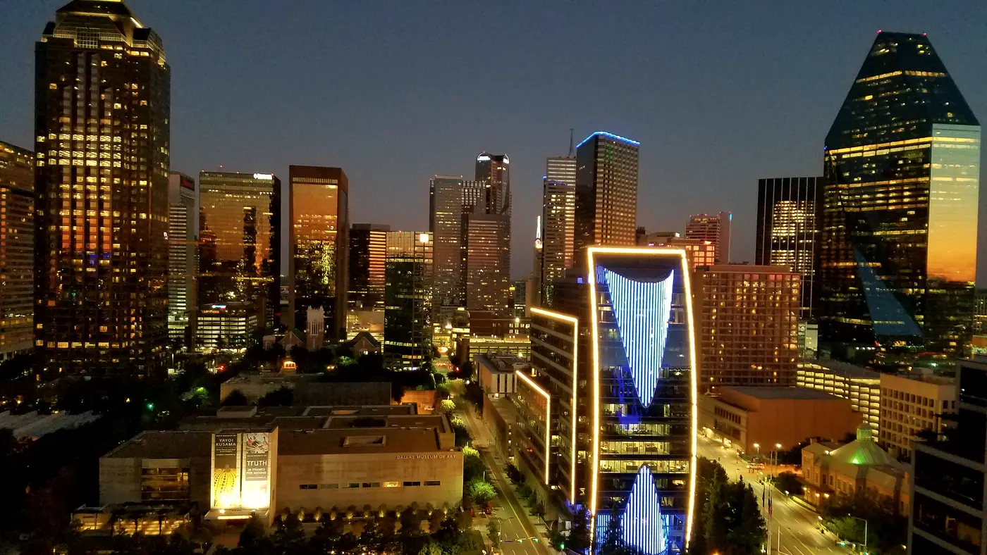 Downtown Dallas towers lit up at blue hour