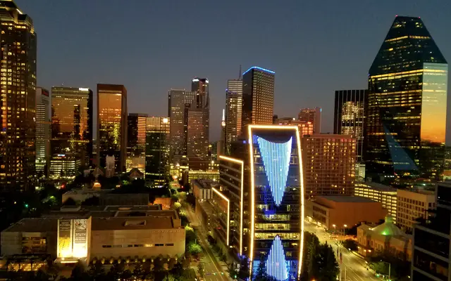 Downtown Dallas towers lit up at blue hour