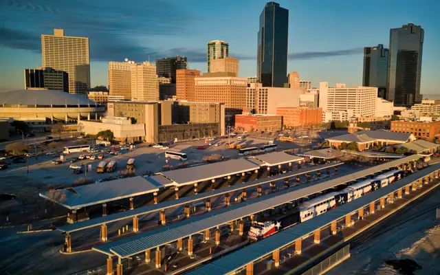 Fort Worth skyline in golden light above the rail station